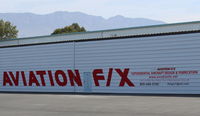  - AVIATION F/X has designed, built, modified, improved, or otherwise finished over fifty varied Experimental Aircraft airworthy completions. New sign on their repainted huge hangar.  - by Doug Robertson