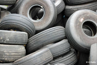  - Looking tired at Dundee. A pile of discarded aircraft tyres await recycling at Dundee EGPN. - by Clive Pattle