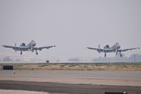  - Two A-10Cs from the 190th Fighter Sq., Idaho ANG making a formation landing on a 4 mile vis, smoky day. - by Gerald Howard