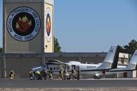  - Smoke jumpers loading up on the NIFC ramp. - by Gerald Howard