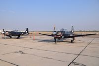  - Two T-34C trainers from VMFAT-101 Sharpshooters, NAS Miramar, CA parked on the south GA ramp. - by Gerald Howard