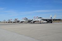  - New F/A-18E from VX-31 Dust Devils parked next to four F/A-18Cs from VMFA-232 Red Devils on the south GA ramp. - by Gerald Howard