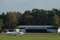 EDWN, Hangar of Luftsportring Grenzland e.V. Nordhorn at Klausheide (Nordhorn-Lingen) airfield, Germany. Piper PA-28-161 Warrior II D-EFZB of VfM is preparing for take off., photo by Van Propeller