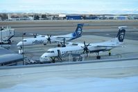  - dash 8s parked on the west end of the Alaska ramp. - by Gerald Howard