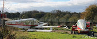  - Scrapyard area at Dunkeswell, includes L-R N23181, TC-NLB and G-BPRV. - by Clive Pattle