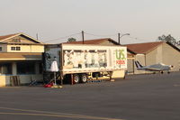  - Thomas Fire Airborne Firefighters need to be fed-this semi-trailer is the Food source. Smoky sky above and beyond. - by Doug Robertson