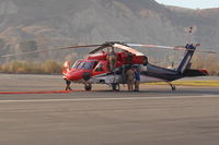  - Preparing this FireBomber for another sortie-The Thomas Fire. - by Doug Robertson