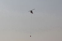  - Firebomber returning to SZP Thomas Fire Firebase with dumped sling load. Please view large. - by Doug Robertson
