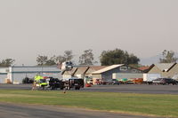  - Helicopter FireBomber nearly landed at SZP Thomas Firebase after fire-retardant drop at nearby fire scene. - by Doug Robertson