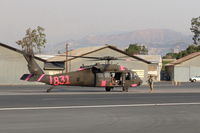  - Unknown FireBomber at SZP Thomas Fire FireBase, landed. Note smoky sky. - by Doug Robertson
