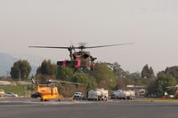  - Inbound FireBomber to land SZP Firebase, no registration markings. Note smoky sky. - by Doug Robertson