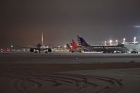  - Early morning and a United 737 is the first out of the gates. - by Gerald Howard