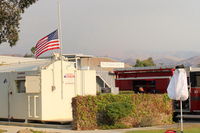  - The Thomas Fire SZP Firebase Flag at half-staff honoring the 32 year old fireman and the 70 year old woman who have thus far separately perished in the record-size California wild fire. - by Doug Robertson