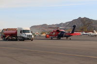  - N135BH 1987 Sikorsky FIREHAWK S-70A-27, GE T700 Series, Restricted class firebomber, at SZP Fire Base with associated support gear - by Doug Robertson