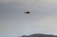  - CROMAN helicopter with Phos Chek sling load dumped, returning to SZP Firebase - by Doug Robertson
