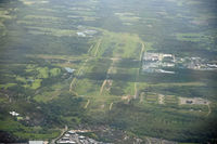  - The former RAF and USAF base at Greenham Common, as seen from Bulldog G-GRRR. The main runway can just be picked out to the right of centre. Now being returned to nature, some hardened shelters still remain (lower right). - by Howard J Curtis