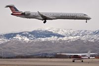  - American landing RWY 10R while the Cessna waits and the snows move closer. - by Gerald Howard