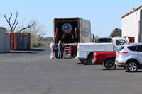  - MAERSK LINE arrival truck to unload Kimball PITTS Model 12 biplane aircraft for reassembly. Maersk  is largest international shipper using ocean freighters. Location-behind Ray's Aviation. Some ocean freight containers in left side past Tee Hangar. - by Doug Robertson