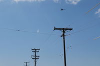  - A Ventura County Sheriff Helicopter maneuvering over and near CMA-Airport on test exercises today. Their Shooting Practice Range is just west of CMA airport western boundary. - by Doug Robertson