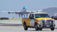  - Safety truck with KLM 747 PH-BFD departing the runway. at SFO 2018. - by Clayton Eddy