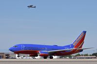  - The Cessna took off a few seconds earlier from 10R, but the Southwest jet on 10L caught up pretty fast. - by Gerald Howard
