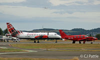  - Dundee - Apron view. Loganair Saab 340 G-LGNU and visiting PA31 OE-FIS and Legacy G-HUBY share the space. In the distance based PA34 G-CAHA is on finals to land. - by Clive Pattle