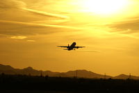  - A takeoff into an amazing Arizona sunset.  This picture is not adjusted; this is the way the sky really looked. - by Dave Turpie