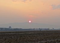  - Sunrise during the fire season. Visibility could be from 6 to 2 miles during August. - by Gerald Howard