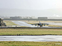  - The sunshine after the rain - A Tornado GR4 is towed across the airfield - by Clive Pattle