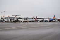  - Mid day flights in on north side of Concourse B. - by Gerald Howard