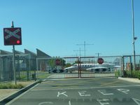  @ Essendon Airport - A Learjet 36, N82GG, taxying through the level crossing gates over Wirraway Road, Essendon Airport. - by red750