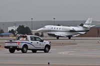  - Aircraft had declared an emergency with landing gear problems. Aircraft landed safely. Operations truck standing by and made the required runway FOD check after landing. None found. - by Gerald Howard