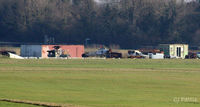  - Long distance view of the airfield dump at Thruxton - on the south side - showing the hulks of three unidentified helicopters, including a Westland Scout AH.1 airframe. - by Clive Pattle