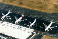  - APOV of 'Old Eagle Farm' International Airport YBBN on 12Aug1992. The line-up on the ramp (from front right to left) is a JAL Super Resort Express B747-246B, an Air New Zealand B767, a Qantas B747-338, and a British Airways B747-436.
 - by Walnaus47