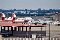  - Two water bombers and two F/A-18Cs parked on the north GA ramp. - by Gerald Howard
