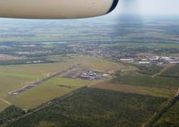  - Bundaberg Airport YBUD ‘Airport Overview’ as seen from Qantaslink DHC-8-102 Dash8 VH-TNW arriving from Brisbane YBBN on 31Dec2002. (‘Sugarland’ visible at right). - by Walnaus47