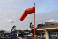  - Near midfield replaced windsock shows mild Santana winds favoring Rwy 04 usage - by Doug Robertson