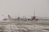  - Three airliners trying to de ice at their gates at the same time. - by Gerald Howard
