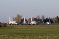  - North West corner of the airfield has become a temp storing area during these hard timesBritish Airways Embraers G-LCAA, G-LCAB, G-LCYF share with old girl Fokker 70 VH0NUV - by AirbusA320