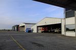  @ EDWS - airside view of apron and hangars at Norden-Norddeich airfield - by Ingo Warnecke