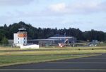  @ Dahlemer Binz Airport - view across the airfield of the western hangars and tower at Dahlemer Binz airfield - by Ingo Warnecke