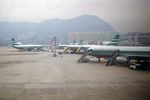  - Scan of a poor photo of the Cathay ramp at Kai Tak HKG during a foggy morning landing in 1993. - by PhilR