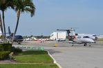  @ Pompano Beach Airpark Airport - Pompano apron seen from the parking lot next to the terminal - by FerryPNL