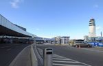  - streetside view of terminals and tower at Wien airport - by Ingo Warnecke