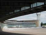  - eastern buildings / hangars seen from the covered boarding area of the terminal of the former Tempelhof airport - by Ingo Warnecke