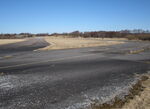  - Seen from the edge of the runway in the eastern part of the closed Vaerloese Air Base in Denmark: To the left Taxiway Alpha. The curved taxiway-like section to the right was used for parking of military aircraft from foreign NATO countries. - by Jan Lundsteen-Jensen