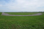  - The north-western part of the closed Vaerloese Air Base in Denmark. To the left taxiway parallel to runway and towards the right Taxiway Echo straight to Runway 10. Curved section in foreground used for aircraft parking, mostly foreign NATO planes. - by Jan Lundsteen-Jensen