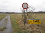  - DANGER Armed Aircraft-sign in the north-western part of the closed Vaerloese Air Base in Denmark. The sign was later removed. - by Jan Lundsteen-Jensen