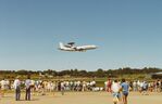  - NATO Boeing E-3A Sentry 90449 flying over Runway 10 at Vaerloese Air Base Open House 1988 in Denmark. In background left to right: RAF C-130K, RAF Red Arrows Hawks being refueled, RAF Harrier and German Tornado side by side at hangar. - by Jan Lundsteen-Jensen
