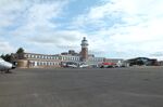  - airside view of the old 1930s terminal, tower (today a Crowne Plaza hotel) and hangar with exhibition of vehicles and aircraft preserved by the Speke Aerodrome Heritage Groups (SAHG) on the former apron  - by Ingo Warnecke